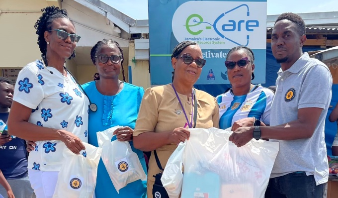 Representatives of Island Stars Academy, including Shauna Langley, Dwayne Thomas, and Shamari Malcolm, pose with staff members of the Old Harbour Clinic during the Humanitarian Drive on July 10, 2026.