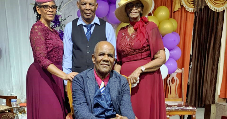 Bishop Neville Currie (seated), is surrounded by daughter Sheryl Currie-Clarke (left), son-in-law Leacroft Clarke (centre) and wife Esmay Morgan-Currie. (Contributed Photo)