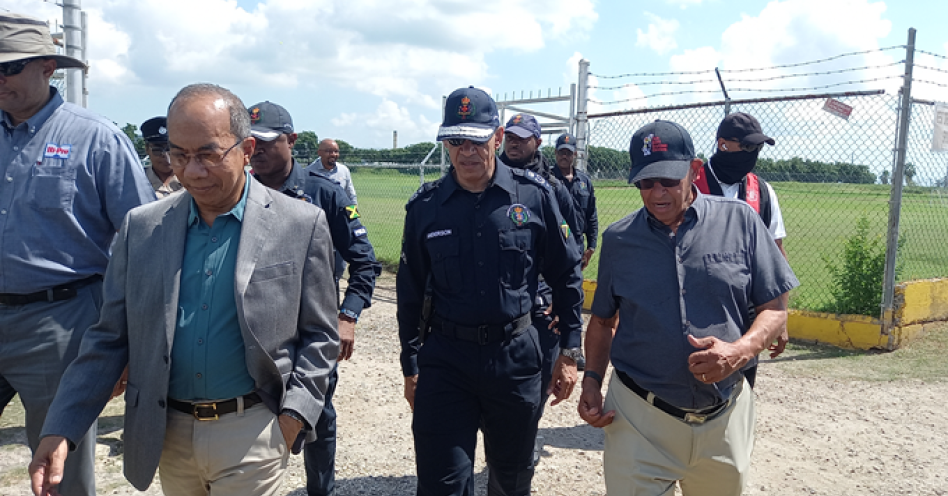 Security Minister Dr Horace Chang leading a team of high officials when he visited the community of Spring Village. (IH News Photo)