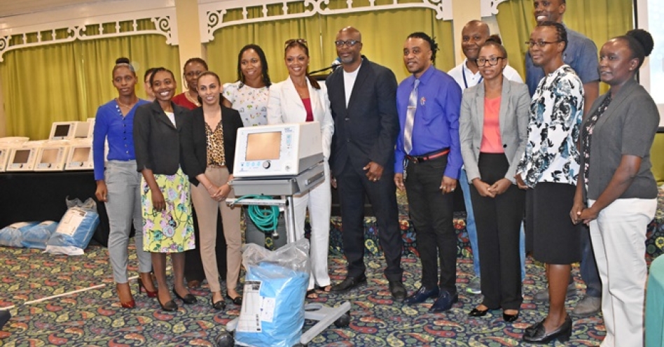 Dr. Trevor Dixon (centre), CEO and Founder of JAHJAH Foundation and Mrs. Coleen Robinson-Cobblah (centre), Assistant Director Nursing Quality & Professional Practice, Montefiorre Medical Centre share photo with representatives from the 12 hospitals who received BIPAP machines.