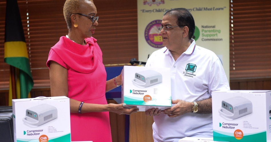 Minister of Education and Youth, Hon. Fayval Williams (left), receives 40 compressor nebulisers from businessman, Gul Mansuhkani, during a recent handover of the machines at the Ministry’s National Heroes Circle offices in Kingston.