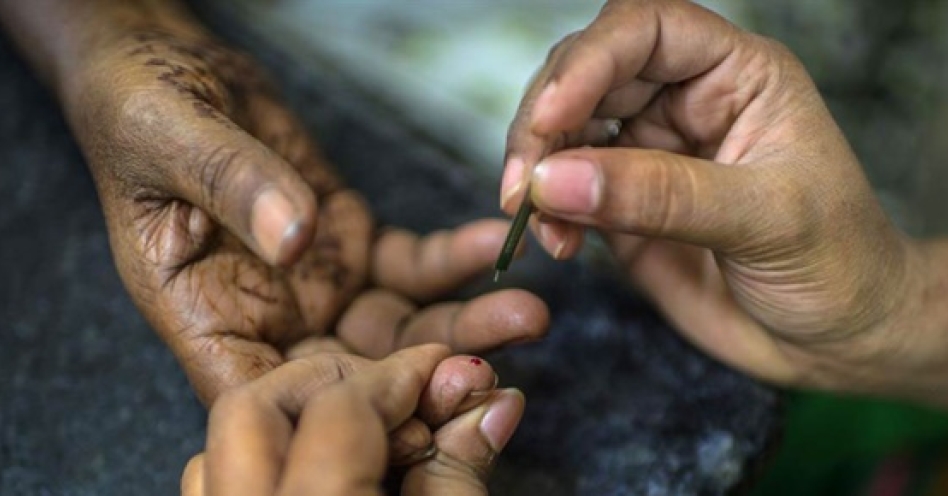A health worker checks a diabetic patient's blood sugar levels. (Image Credit: WHO)